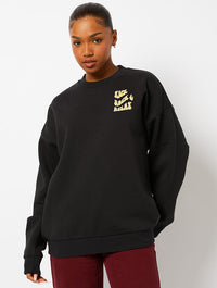 Peanuts x Skinnydip Snoopy Kick Back & Relax Sweatshirt in Black