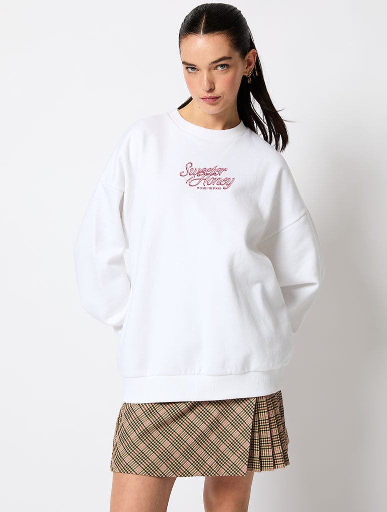 Disney Sweeter Than Honey Winnie The Pooh Sweatshirt in Ecru Hoodies & Sweatshirts Skinnydip London