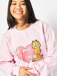 Garfield x Skinnydip Ask Me If I Care Sweatshirt in Pink Hoodies & Sweatshirts Skinnydip London