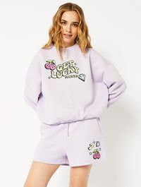 Get Lucky Oversized Sweatshirt in Purple Hoodies & Sweatshirts Skinnydip London