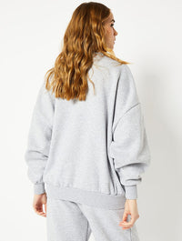 Money Cant Buy Happiness Oversized Sweatshirt in Grey Hoodies & Sweatshirts Skinnydip London