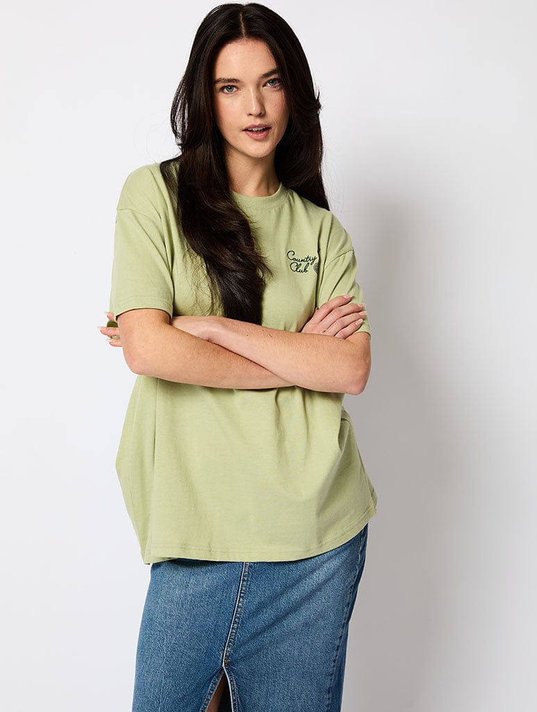 Peanuts x Skinnydip Country Club T-Shirt in Green Tops & T-Shirts Skinnydip London