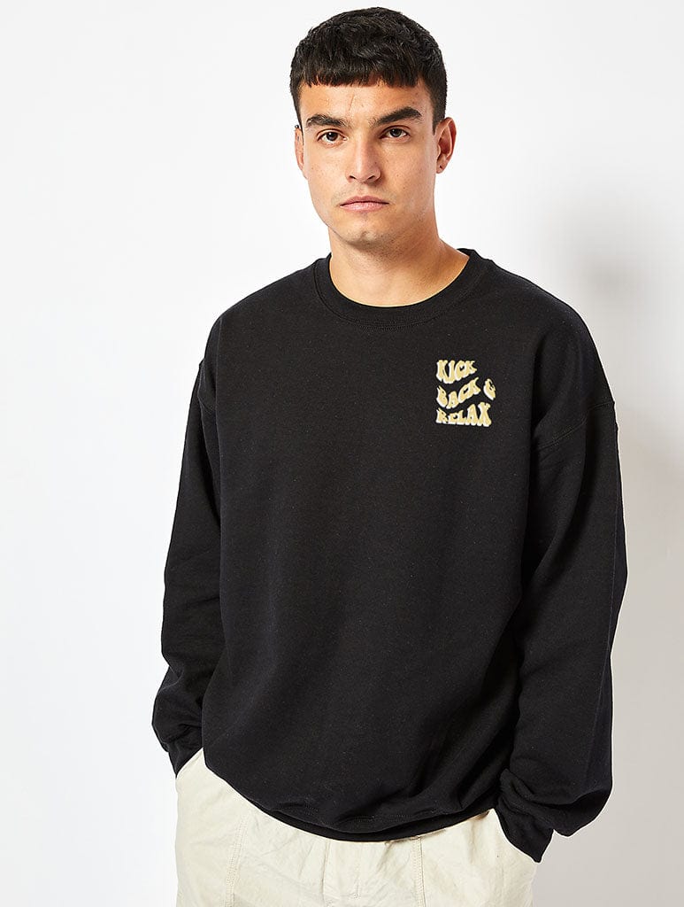 Peanuts x Skinnydip Snoopy Kick Back & Relax Sweatshirt in Black Hoodies & Sweatshirts Skinnydip London