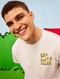 Peanuts x Skinnydip Snoopy Kick Back & Relax T-Shirt in Ecru Tops & T-Shirts Skinnydip London