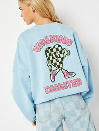 Walking Disaster Graphic Oversized Sweatshirt In Blue Hoodies & Sweatshirts Skinnydip London