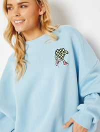 Walking Disaster Graphic Oversized Sweatshirt In Blue Hoodies & Sweatshirts Skinnydip London